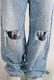 Blue baggy damaged jeans